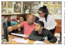  ??  ?? Dyvona Govender, Keane Govender and Karesa Munsamy excitedly crowd around UKZN specialist librarian Siya Narie as they look up details of their indentured ancestors.