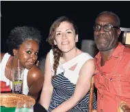  ?? PHOTO BY JANET SILVERA ?? From left: Sarah ‘JetSet Sarah’ Liu, ‘Caribbean Journal’ from the United States; Virginia Casado, press manager for RIU; and Brian Major, Tralliance from the United States, share lens time during a beach party at Riu Reggae on Tuesday night.