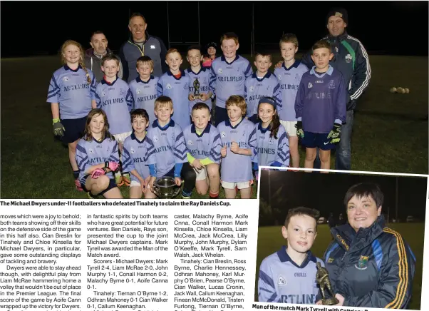  ??  ?? The Michael Dwyers under-11 footballer­s who defeated Tinahely to claim the Ray Daniels Cup. Man of the match MarkTyrrel­l with Caitriona Byrne.