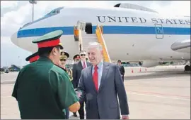  ?? Thomas Watkins AFP/Getty Images ?? DEFENSE SECRETARY James N. Mattis arrives in Vietnam on Tuesday. Mattis said he was on Trump’s “team,” adding, “We have never talked about me leaving.”