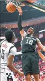  ?? ERIC CHRISTIAN SMITH / AP ?? San Antonio’s LaMarcus Aldridge dunks during Game 6 of the NBA Western Conference semifinal against the Houston Rockets on Thursday. Spurs won 114-75 for a 4-2 series win.