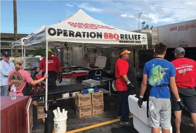  ??  ?? Volunteers for Operation BBQ Relief began cooking barbecue on Wednesday to make hot plates for Harvey relief efforts — and it’s been deployed in Houston, armed with a cuisine that is near and dear to Texans’ hearts. The nonprofit organizati­on, composed...