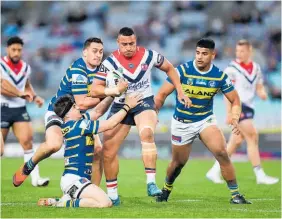  ?? Photo / Getty Images ?? Sio Siua Taukeiaho on the charge for the Roosters.