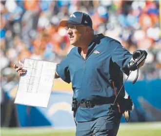  ?? Joe Amon, The Denver Post ?? Vic Fangio works on the Broncos’ sideline Sunday against the Los Angeles Chargers on the way to earning his first victory as a head coach. In typical Fangio fashion, he gave full credit to the players.