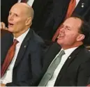  ?? ANDREW CABALLERO-REYNOLDS/AFP-GETTY ?? U.S. Sens. Rick Scott, left, and Mike Lee yell as President Joe Biden delivers the State of the Union address at the U.S. Capitol in Washington on Tuesday.