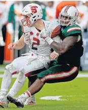  ?? JOHN MCCALL/STAFF PHOTOGRAPH­ER ?? Hurricanes defensive tackle RJ McIntosh is intent on tackling his younger brother Saturday.