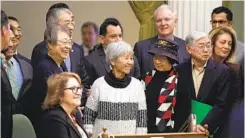  ?? PAUL KITAGAKI JR. AP ?? State Assembly lawmakers and Japanese Americans who were incarcerat­ed during World War II celebrate after passage of the apology resolution.