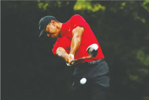  ?? — GETTY IMAGES FILES ?? Tiger Woods —using a TaylorMade M5 — plays his shot from the second tee during the final round of the Masters on April 14, in Augusta, Ga.