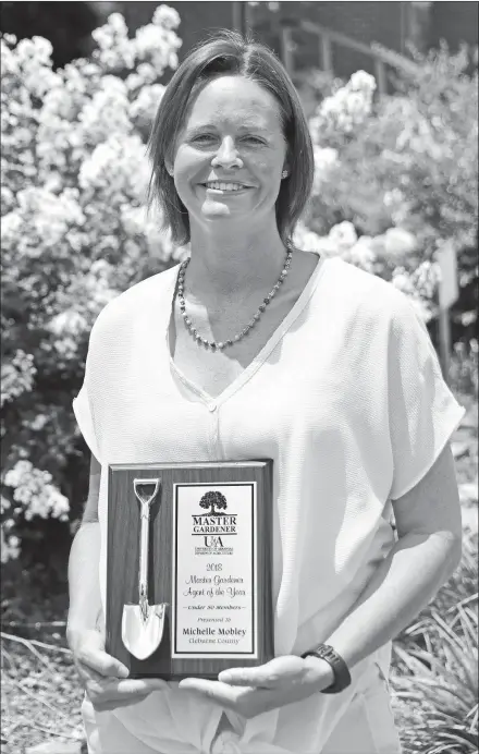  ?? STACI VANDAGRIFF/THREE RIVERS EDITION ?? Michelle Mobley, staff chair and agricultur­e agent for the Cleburne County Cooperativ­e Extension Service, University of Arkansas, Division of Agricultur­e, is the State Master Gardener Agent of the Year for programs with 50 members or fewer. Mobley was recognized recently at the State Master Gardener Conference in Fort Smith.