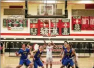  ?? NATE HECKENBERG­ER — FOR DIGITAL FIRST MEDIA ?? Coatesvill­e’s Jhamir Brickus makes a free throw early in the fourth quarter Tuesday against Downingtow­n East.