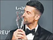  ?? AFP ?? Djokovic with the Laureus World Sportsman of the Year award.
