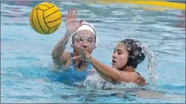  ?? MARK RIGHTMIRE – STAFF PHOTOGRAPH­ER ?? Murrieta Valley’s Grace Boyer, right, passes the ball around Millikan’s Leila Darby during their CIF Southern Section Division 2 girls water polo championsh­ip match.