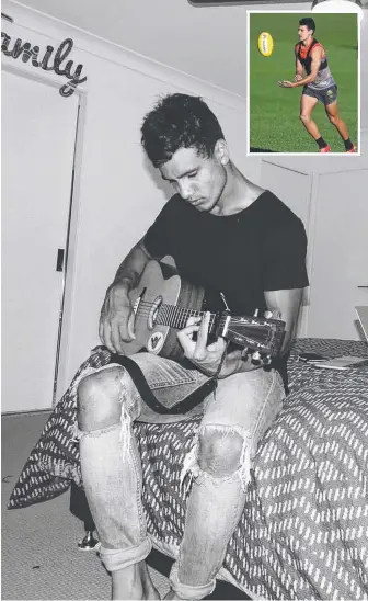  ?? Picture: SUPPLIED ?? Suns footballer Callum Ah Chee plays guitar in his Gold Coast home.