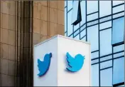  ?? ASSOCIATED PRESS ?? THIS OCT. 26, 2016, FILE PHOTO shows a Twitter sign outside of the company’s headquarte­rs in San Francisco. Twitter will be enforcing stricter policies on violent and abusive content such as hateful images or symbols, including those attached to user...