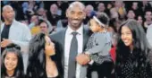  ?? AP ?? LA Lakers great Kobe Bryant with his family at the ceremony to retire his two jersey numbers.