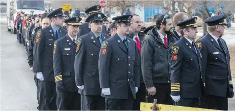  ?? PHOTOS: LIAM RICHARDS ?? Members of the public lined the snowy streets to watch firefighte­rs, police officers, paramedics, search and rescue personnel and Mounties march to the Rosetown Civic Centre on Tuesday to honour Darrell Morrison, a volunteer firefighte­r killed in the line of duty.