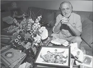  ?? Amy Beth Bennett, Sun Sentinel/TNS ?? Kalman “Kal” Fagan, 78, is shown in his home on Sept. 1 in Lauderhill, Fla. In the early 1960s, Fagan managed a rock ‘n’ roll group called Robby and The Troubadour­s. The group had a popular track called The Lemon Twist. He is currently working towards...