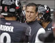  ?? JEFF DEAN / AP ?? Cincinnati coach Luke Fickell and quarterbac­k Desmond Ridder (9) know the Bearcats have an opportunit­y to impress the nation when they travel Saturday to South Bend, Indiana, to face No. 9 Notre Dame.