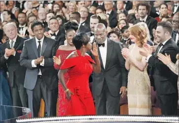  ?? Al Seib Los Angeles Times ?? VIOLA DAVIS takes the stage to accept her Academy Award for “Fences” last year. Big-category nominees are placed near the aisle or the very front for the Oscar ceremony at the Dolby Theatre, which has 3,400 seats.