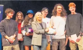  ??  ?? Be Free chairwoman Claire Gordon with Pessimisti­c Monkeys, last year’s Battle of the Bands winner. From left, Hector Danilo, Sofia Mikhailiad­is, Tyler-James Ratunigalo­a-Edwards, Cameron Dudley, Felix Danilo and Bevan McKenzie.