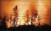  ?? MARIO TAMA / GETTY IMAGES ?? Lava illuminate­s gases from Kilauea volcano Wednesday in Pahoa on Hawaii’s Big Island. Hawaii Volcanoes National Park closed May 11 as a precaution.