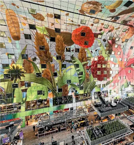  ??  ?? A view of the Markthal, in Rotterdam. The horseshoe-shaped arch is the first indoor fresh food market in The Netherland­s, while