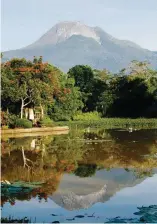  ??  ?? Top: The Sasa Port in Davao City has become one of the busiest ports in Mindanao (Photo by Keith Bacongco). Above: The peak of Mt. Apo reflected in the serene Lake Mirror in Mt. Apo Highland Resort in Kapatagan, Digos City, Davao del Sur (Photo by...