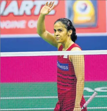  ?? AFP ?? India's Saina Nehwal reacts after winning her quarterfin­al women's singles match against Scotland's Kirsty Gilmour.