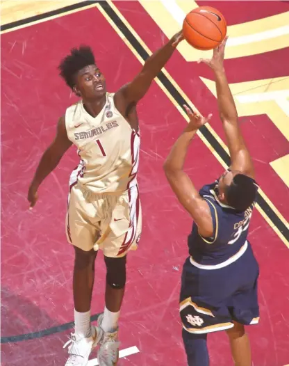  ?? | PHIL SEARS/ AP ?? Florida State’s Jonathan Isaac blocks a shot by Notre Dame’s Bonzie Colson during the first half Wednesday.