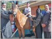  ?? PICTURE: SIYANDAMAY­EZA ?? From left, Mohammed Shah, chairman of the governing body of Swanvale Primary School, pupil Miguel Soobramone­y, principal of The Special Needs School Bilkees Musthafa and Swanvale principal Nash Singh, with Zara.