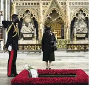  ?? AARON CHOWN AP ?? Queen Elizabeth II wears a mask in public for the first time as she marks the centenary of the burial of the Unknown Warrior, in Westminste­r Abbey in London, last week.