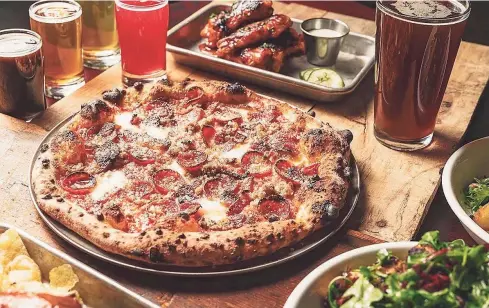  ?? Winter Caplanson / Contribute­d photos ?? A carne pizza from the wood-fired pizza oven at Broad Brook Brewing in Suffield. Below, Roasted cauliflowe­r from Broad Brook Brewing.