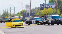  ?? JIM THOMPSON/JOURNAL ?? Deputies investigat­e at the scene of an alleged road rage shooting Thursday afternoon on Edith NE near Montaño.