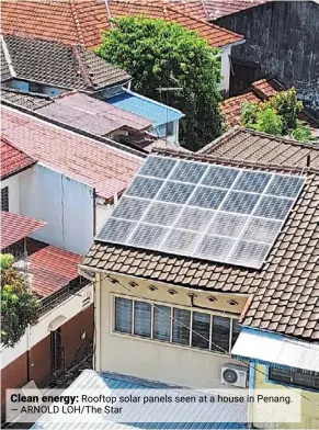  ?? — arnold Loh/the star ?? Clean energy: rooftop solar panels seen at a house in Penang.