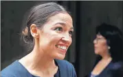  ?? [AP PHOTO] ?? Alexandria Ocasio-Cortez, the winner of a Democratic Congressio­nal primary in New York, reacts while talking to the media, Wednesday in New York. Ocasio-Cortez, 28, upset U.S. Rep. Joe Crowley in Tuesday’s election.