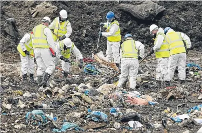  ?? Picture: PA. ?? Police searching the landfill site in Milton, Cambridges­hire.