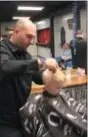  ?? CHARLES PRITCHARD — ONEIDA
DAILY DISPATCH ?? Richard Rossi cuts Hudson Bennett’s hair on Saturday, Nov. 17, 2018.