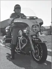  ??  ?? Cpl. Kris Syvertsen of the Charles County Sheriff’s Office’s Traffic Operation Unit in the Special Operations Division sits on his marked patrol motorcycle. The traffic operation unit uses the motorcycle­s to do more efficient patrols on the county’s...