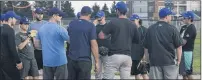  ?? JASON MALLOY/THE GUARDIAN ?? Team P.E.I. softball head coach Mark Quinn speaks to his players during a recent practice at Central Field in Charlottet­own.