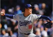  ?? MICHAEL REAVES — GETTY IMAGES ?? Yoshinobu Yamamoto of the Dodgers delivers a pitch during the first inning against the Cubs at Wrigley Field on Saturday in Chicago.