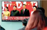 ?? PHOTO: CHUNG SUNG-JUN/GETTY ?? South Koreans watch a television broadcast reporting the North Korean leader Kim Jongun meet Chinese President Xi Jinping in Seoul in March.