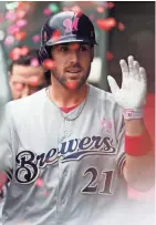  ?? ASSOCIATED PRESS ?? Brewers third baseman Travis Shaw enjoys a confetti celebratio­n in the dugout after his 452-foot home run in the third inning of Sunday’s 7-3 victory over the Colorado Rockies at Coors Field.