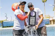  ?? C. MORGAN ENGEL NCAA PHOTOS ?? SDSU women’s tennis head coach Peter Mattera (left) and associate head coach Nicolas Vinel celebrate the Mountain West title last week.