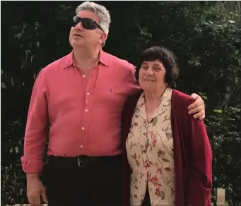  ??  ?? David Quigley and his mother Addis Amicarella pictured in 2018 standing outside the little railway station in Acciano, where Addis left Italy from in 1951 on her journey to Manorhamil­ton.