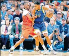  ?? [SARAH PHIPPS/ THE OKLAHOMAN] ?? Oklahoma City's Chris Paul, left, defends Golden State's Glenn Robinson III during Sunday's game at Chesapeake Energy Arena.