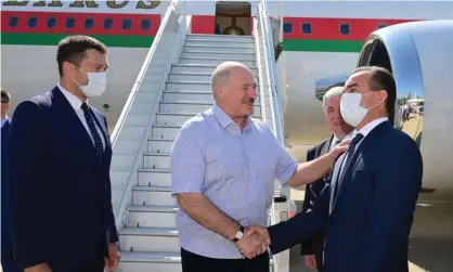  ??  ?? The Belarusian president, Alexander Lukashenko, greets officials during a welcoming ceremony upon his arrival at an airport in Sochi, Russia. Photograph: BelTA/Reuters