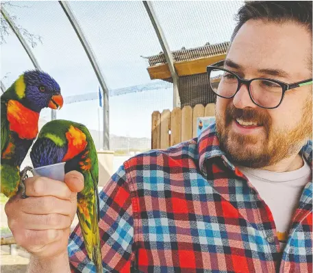  ?? BILL CLAYTEN ?? Bill Clayten, seen with his parrots, was sent a text in error and ended up raising money and gifts for a sick boy in Phoenix.