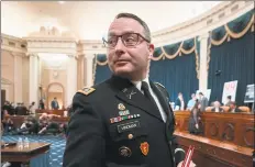  ?? J. Scott Applewhite / Associated Press ?? National Security Council aide Lt. Col. Alexander Vindman leaves the hearing room during a break from testifying before the House Intelligen­ce Committee on Capitol Hill in Washington, Nov. 19.