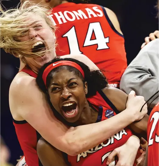  ?? GETTY IMAGES ?? Aari McDonald (bottom) celebrates with teammates after Arizona’s upset Friday of UConn in the women’s Final Four. The Wildcats will face Stanford on Sunday.