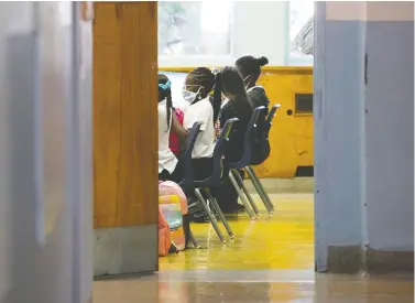  ?? PIERRE OBENDRAUF FILES ?? Parents have a lot to be worried about these days — from COVID outbreaks at schools to the lack of access to a vaccine for younger students, Fariha Naqvi-mohamed says. Here, masked students listen during class at St. Monica school in N.D.G.